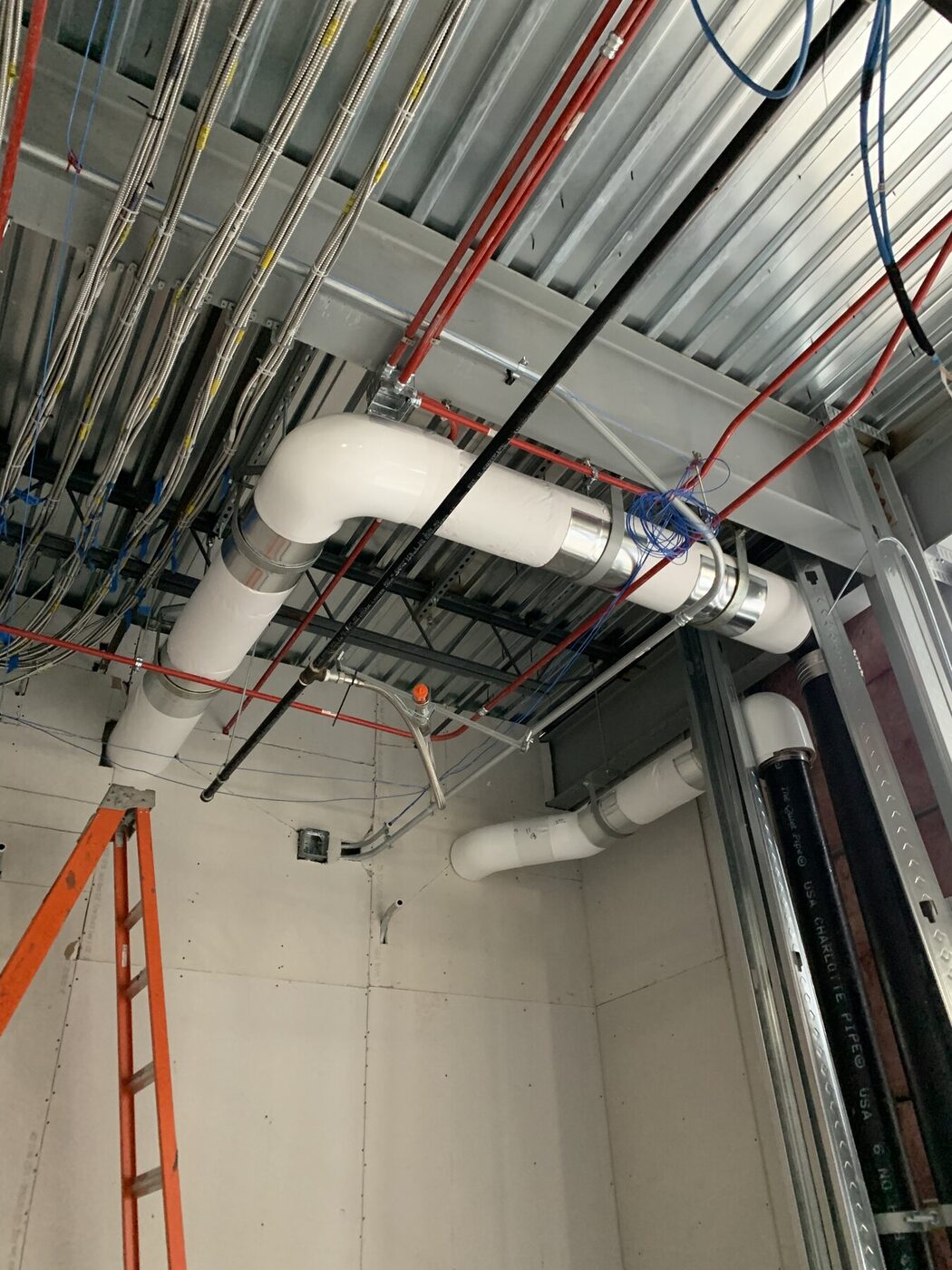 Commercial interior framing and drywall coordinated with overhead building systems